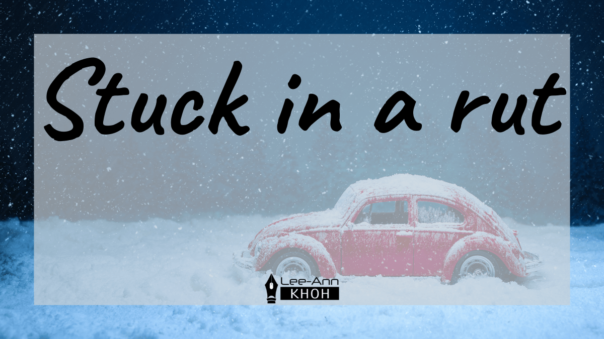 Text reads: Stuck in a rut. Background contains a red car stuck in snow at night.